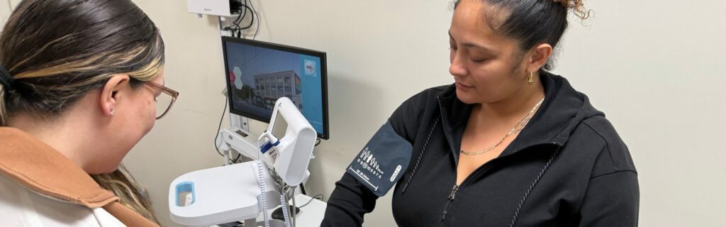 Advanced Practice Provider (APP) Residency Program image of a nurse taking a blood pressure reading of apatient.